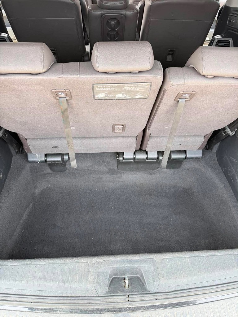 Cargo area after detailing — clean carpet and seats