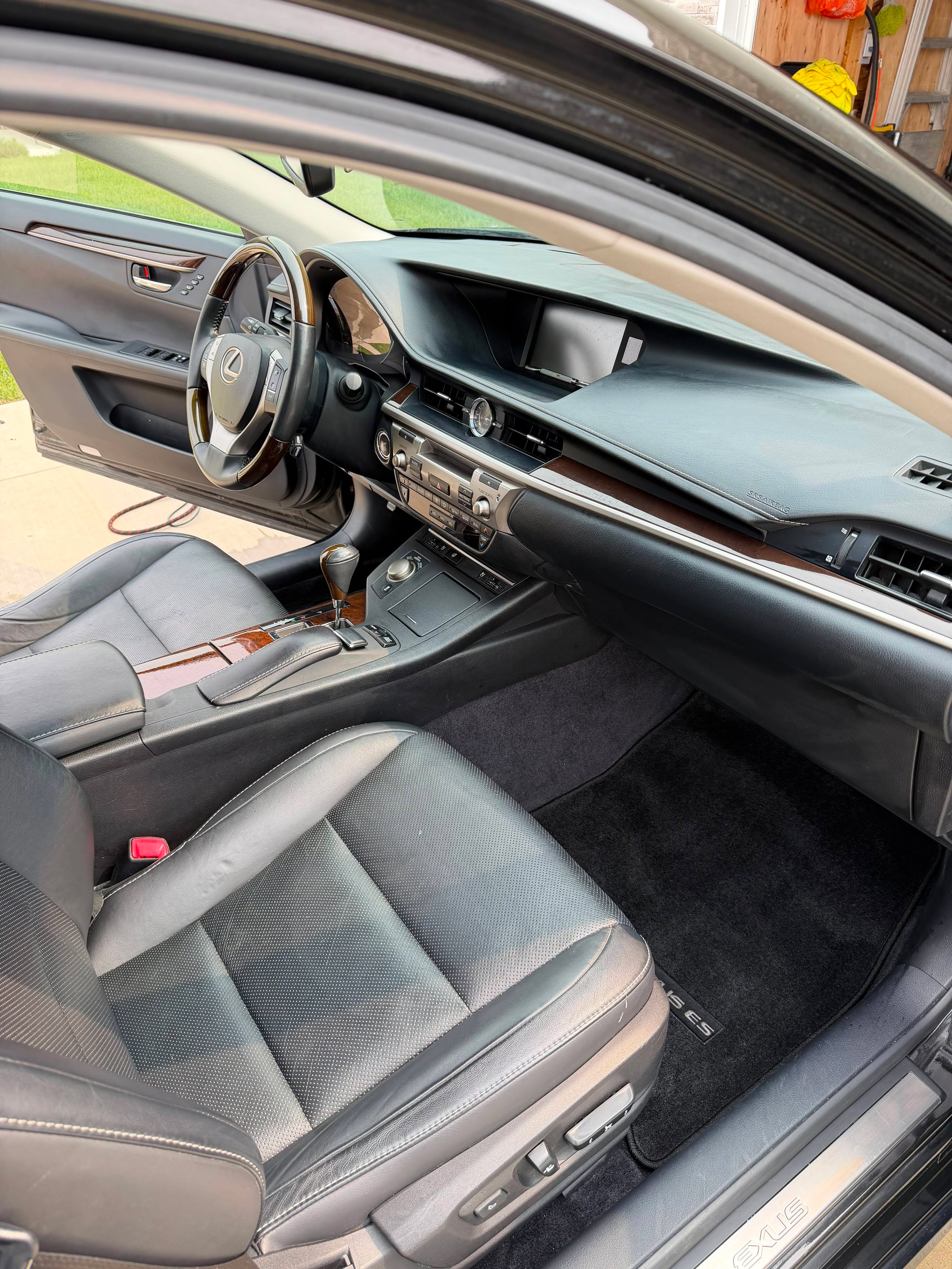 Spotless dashboard and floor mats after detailing